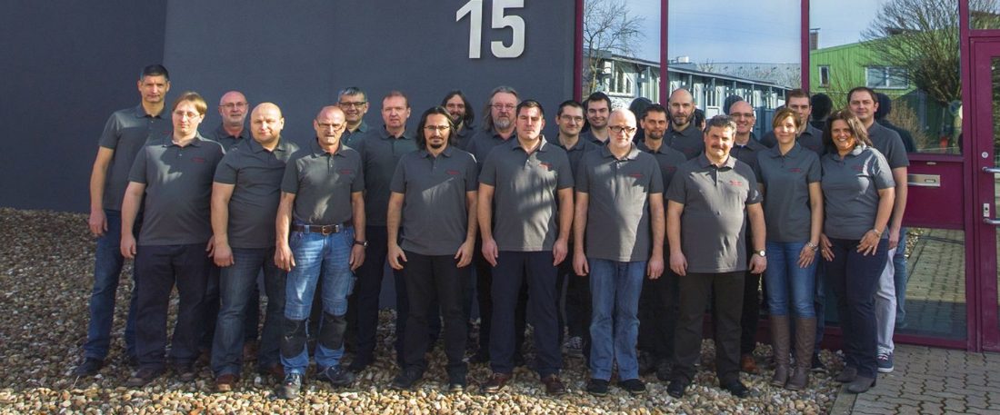 The inotech team in front of the company building in Bietigheim